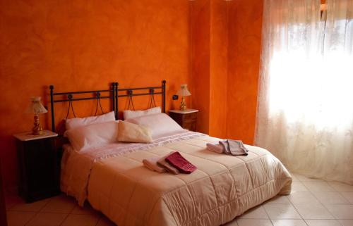 Postel nebo postele na pokoji v ubytování Agriturismo Il podere