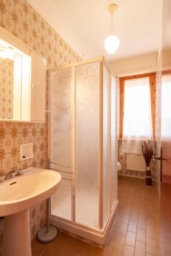 a bathroom with a shower and a sink at Appartamenti RO in Follonica