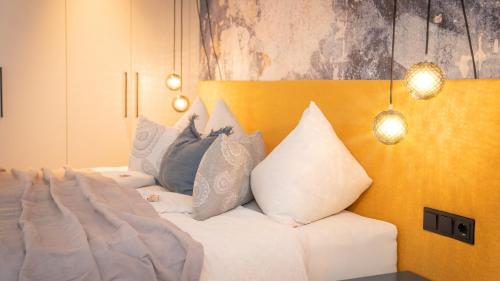 a bedroom with a bed with pillows on it at Königswieser Hof in Königswiesen