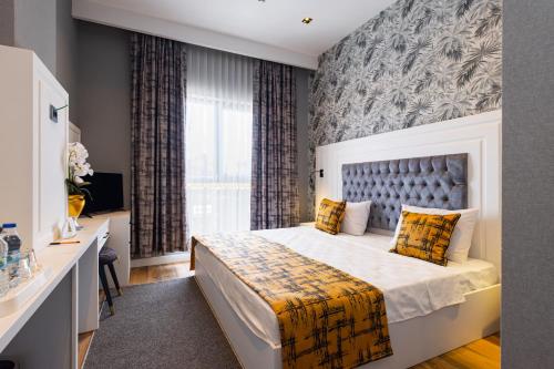 Postel nebo postele na pokoji v ubytování Hipodrom Hotel