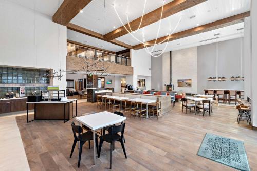 a lobby with tables and chairs in a building at Hampton Inn Big Bear Lake in Big Bear Lake