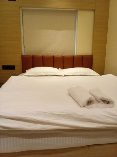 Una cama o camas en una habitación de HOTEL SKYKING