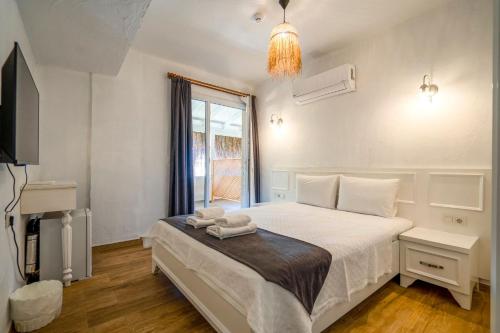 Postel nebo postele na pokoji v ubytování LONDİA OTEL