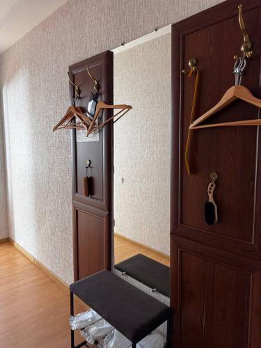 a room with a mirror and a wooden door at Готель Elisavetgrad in Kropyvnytskyi