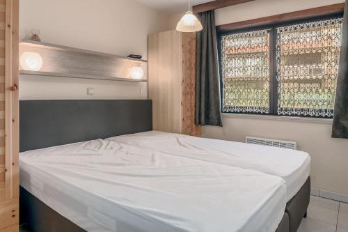 Ένα ή περισσότερα κρεβάτια σε δωμάτιο στο Bercy Gv02 G
