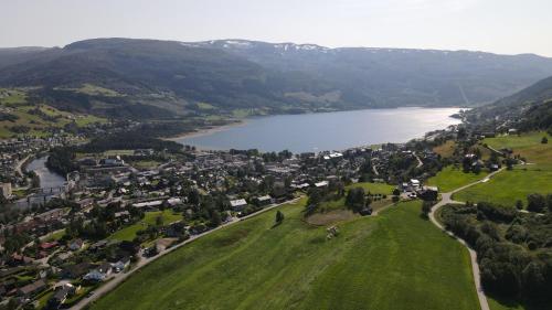 an aerial view of a town next to a lake at Store Ringheim Apartment - Villa Hjadlane in Vossevangen