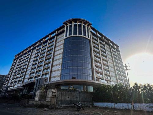 a large building with a lot of windows at Ambition studio apartment at weekend address in Bhatha