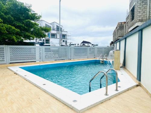 a swimming pool on the roof of a building at Beautiful 2 bed flat in much sought after estate in Moba
