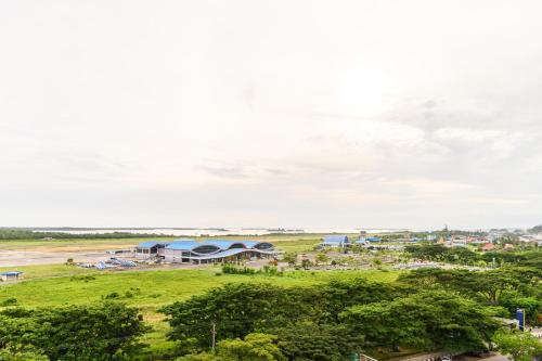 a view of a town with a field and buildings at Aston Sorong Hotel & Conference Center in Sorong