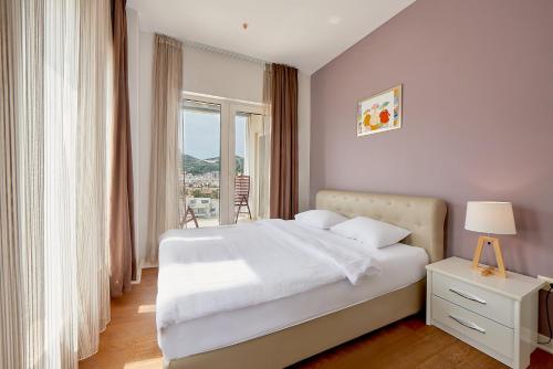 Postel nebo postele na pokoji v ubytování Lux Apartments Sunrior