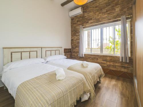 Giường trong phòng chung tại Cubo's Casa El Candil 8 PAX