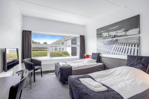 מיטה או מיטות בחדר ב-Sportshotel Vejen
