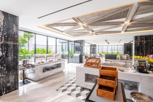 a large kitchen with a lot of windows at Aston Sorong Hotel & Conference Center in Sorong