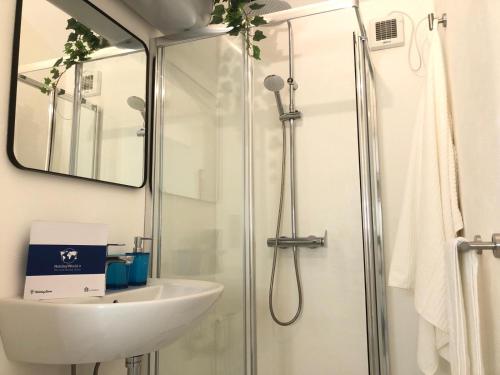 a bathroom with a sink and a shower at House Vincent by Holiday World in Turin