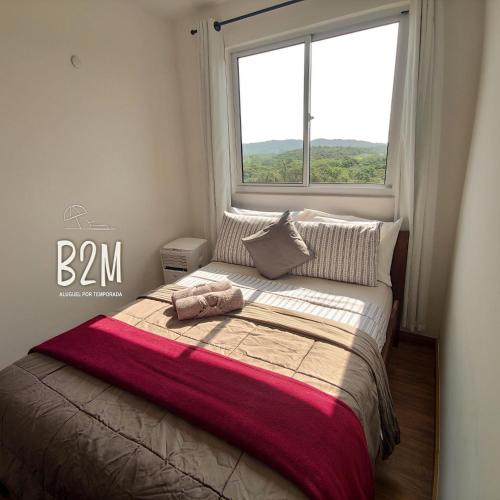 Ένα ή περισσότερα κρεβάτια σε δωμάτιο στο Vila Açoriana Confort club, pé na areia