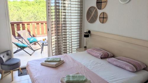 En eller flere senge i et værelse på Duplex T3Bis Presqu'île de la Lagune - Piscine - Mer & Nature