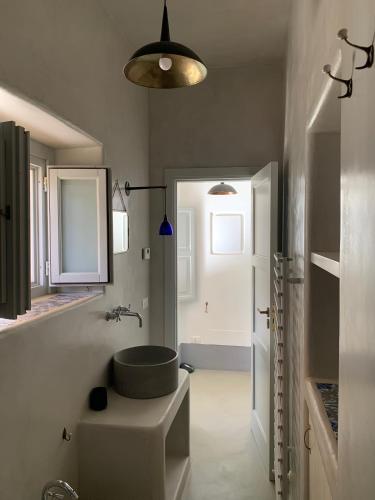 a bathroom with a sink and a tub at Villa Giacinti in Lingua