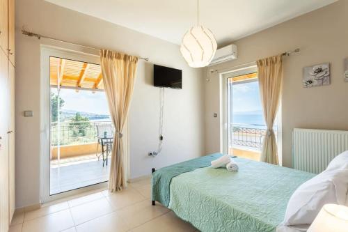 a bedroom with a bed and a view of the ocean at Verga Beachside Getaway with Panoramic Seaviews in Almirón
