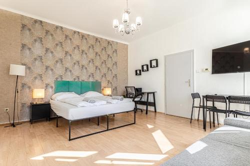 a living room with a bed and a dining room at Vienna Getaway -2BR Apartment Central & Comfort in Vienna