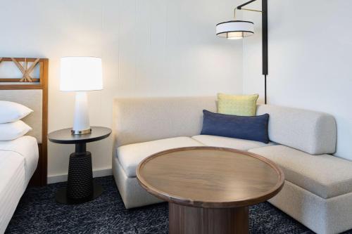 a living room with a couch and a table at OUTRIGGER Kona Resort and Spa in Kailua-Kona