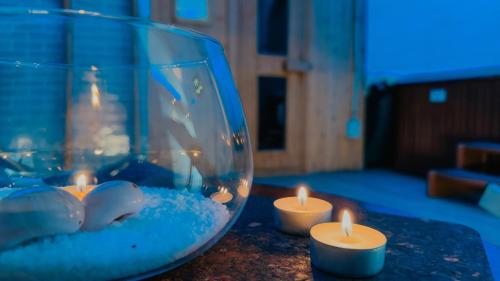 a table with candles and a fishbowl with a tank at Labranda Corralejo Village in Corralejo