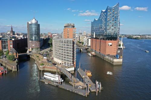 a view of a city with a river and buildings at Eventschiff Grosser Michel in Hamburg