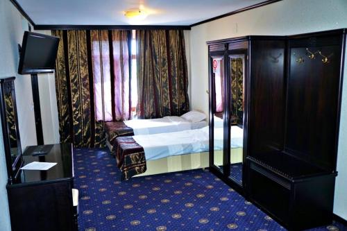 Katil atau katil-katil dalam bilik di Hotel Ambasador