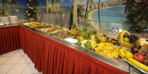 a buffet line with many different types of food at Royal Prince Hotel in Dubai