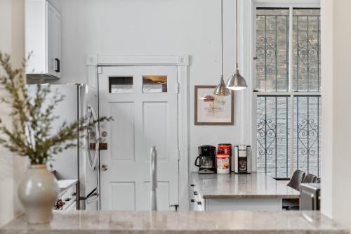 a kitchen with a white door and a counter top at Luxe SFH in the Heart of Old Town in Chicago