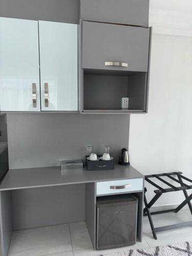 Η κουζίνα ή μικρή κουζίνα στο Le Rubis Guesthouse