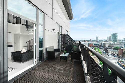 a balcony with a view of a city at Duplex Penthouse Apartment - Birmingham City Centre - Secure Parking - Terrace 1401M in Birmingham