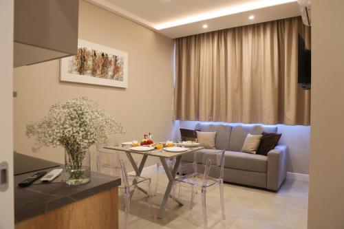 a living room with a table and a couch at Freedom in SantʼAntonio Abate