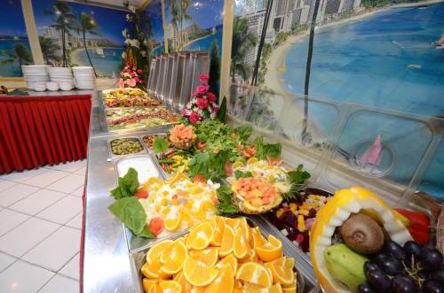 a buffet line with many different types of food at Royal Prince Hotel in Dubai