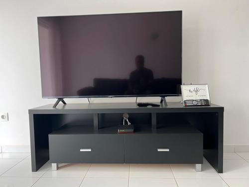 Una televisión o centro de entretenimiento en PIMONTAPARTMENTS