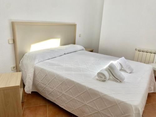 Postel nebo postele na pokoji v ubytování Apartamentos Rurales Flor de la Alcarria