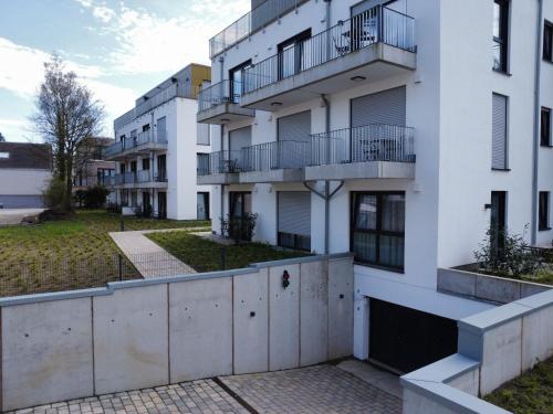 an image of an apartment building at Moderne Apartments im Herzen von Osnabrück I private Tiefgarage I home2share in Osnabrück