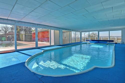 a large swimming pool in a house at Domaine de Hurlevent in Montgaillard-Lauragais