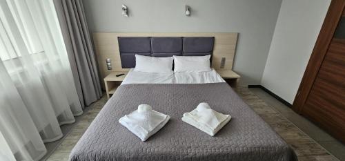 מיטה או מיטות בחדר ב-44 Dominikana