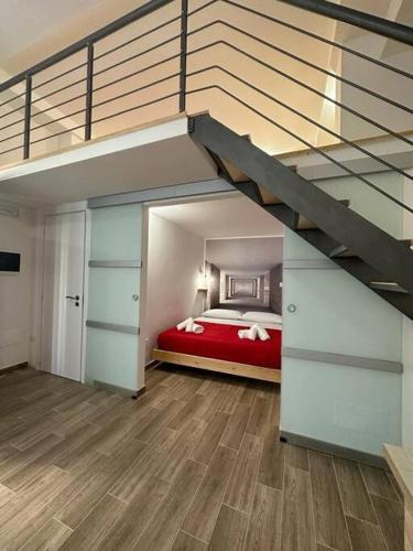 a bedroom with a bed in a loft at Amore e Psiche in Scilla