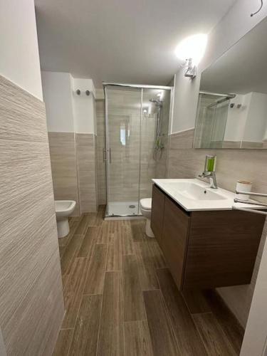 a bathroom with a sink and a toilet and a shower at Amore e Psiche in Scilla