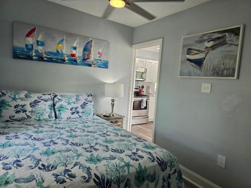 a bedroom with a bed and surfboards on the wall at Iguana Updated Home By Large Imperial River 1 Mi to Beach in Bonita Springs