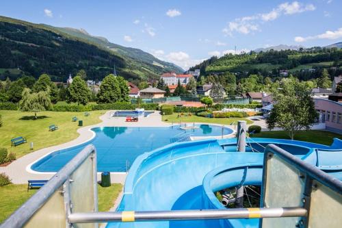 a view of a water park with a slide at Landhaus Nikki in Gmünd in Kärnten