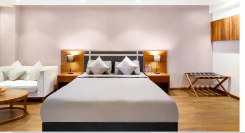 Кровать или кровати в номере EXOTIC STUDIO