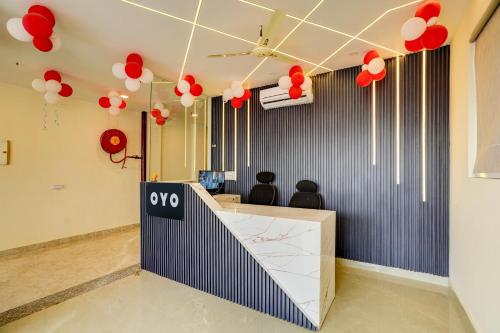 a lobby with red and white balloons hanging from the ceiling at Super OYO Flagship Red Diamond Hotel in Ghaziabad