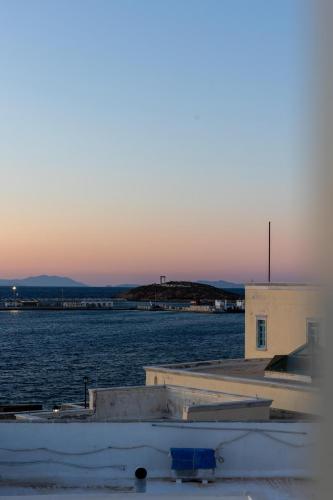 a view of a body of water with a building at Kymata Hotel in Naxos Chora