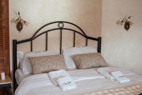 a bed with two towels on top of it at Step to Kotor bay Perast in Perast