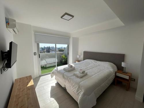 Giường trong phòng chung tại Fk Villa Devoto