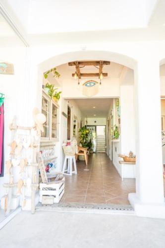a hallway of a home with an archway at Hotel Boutique Pachamama in Mahahual