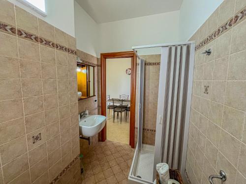 a bathroom with a shower and a sink at Country Home in Crispiano