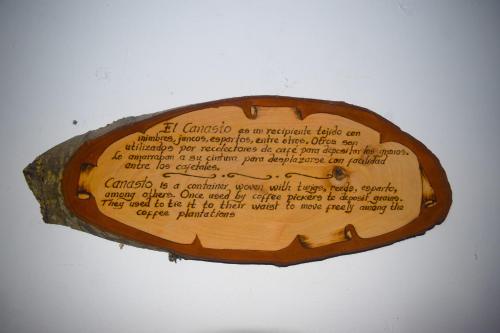 a wooden sign on a wall with writing on it at FILANDIA HOTEL in Filandia